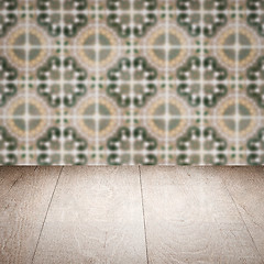 Image showing Wood table top and blur vintage ceramic tile pattern wall