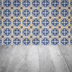 Image showing Wood table top and blur vintage ceramic tile pattern wall