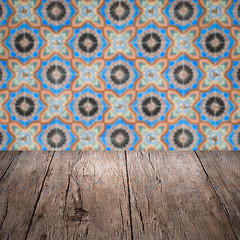 Image showing Wood table top and blur vintage ceramic tile pattern wall