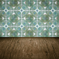 Image showing Wood table top and blur vintage ceramic tile pattern wall