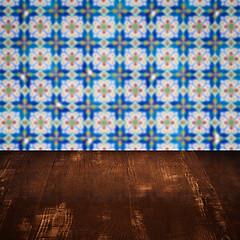 Image showing Wood table top and blur vintage ceramic tile pattern wall