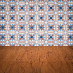 Image showing Wood table top and blur vintage ceramic tile pattern wall