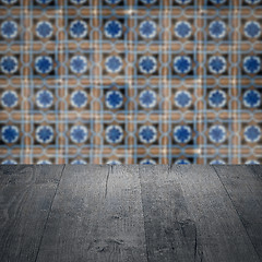 Image showing Wood table top and blur vintage ceramic tile pattern wall