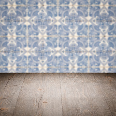 Image showing Wood table top and blur vintage ceramic tile pattern wall