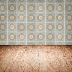 Image showing Wood table top and blur vintage ceramic tile pattern wall