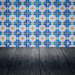 Image showing Wood table top and blur vintage ceramic tile pattern wall