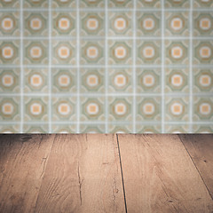 Image showing Wood table top and blur vintage ceramic tile pattern wall