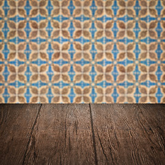 Image showing Wood table top and blur vintage ceramic tile pattern wall