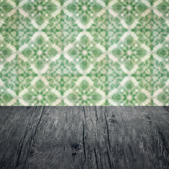 Image showing Wood table top and blur vintage ceramic tile pattern wall