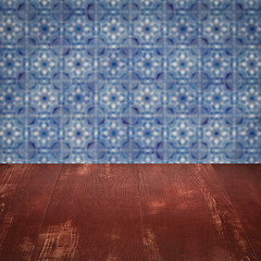 Image showing Wood table top and blur vintage ceramic tile pattern wall