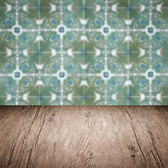 Image showing Wood table top and blur vintage ceramic tile pattern wall