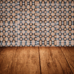 Image showing Wood table top and blur vintage ceramic tile pattern wall