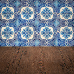 Image showing Wood table top and blur vintage ceramic tile pattern wall