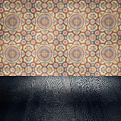 Image showing Wood table top and blur vintage ceramic tile pattern wall