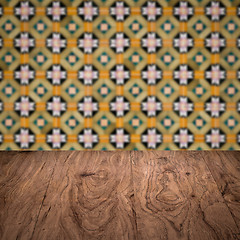 Image showing Wood table top and blur vintage ceramic tile pattern wall