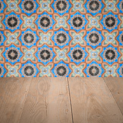 Image showing Wood table top and blur vintage ceramic tile pattern wall