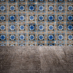 Image showing Wood table top and blur vintage ceramic tile pattern wall