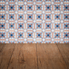 Image showing Wood table top and blur vintage ceramic tile pattern wall