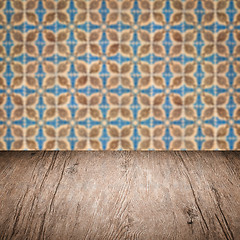 Image showing Wood table top and blur vintage ceramic tile pattern wall