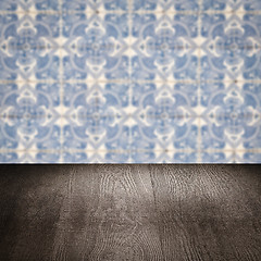 Image showing Wood table top and blur vintage ceramic tile pattern wall