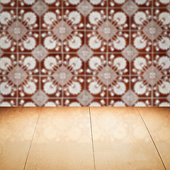 Image showing Wood table top and blur vintage ceramic tile pattern wall