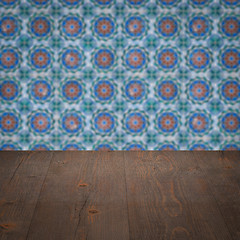 Image showing Wood table top and blur vintage ceramic tile pattern wall