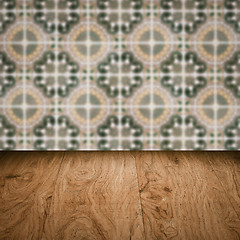 Image showing Wood table top and blur vintage ceramic tile pattern wall