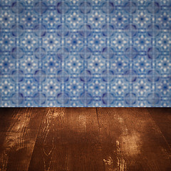 Image showing Wood table top and blur vintage ceramic tile pattern wall