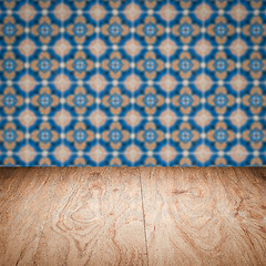 Image showing Wood table top and blur vintage ceramic tile pattern wall