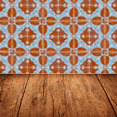 Image showing Wood table top and blur vintage ceramic tile pattern wall