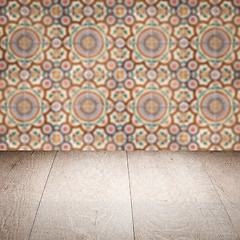 Image showing Wood table top and blur vintage ceramic tile pattern wall