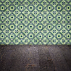 Image showing Wood table top and blur vintage ceramic tile pattern wall