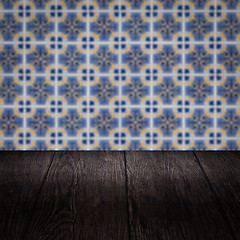 Image showing Wood table top and blur vintage ceramic tile pattern wall