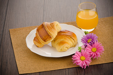 Image showing Croissants with orange juice 