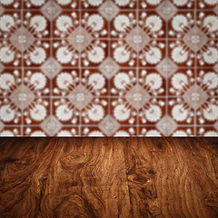 Image showing Wood table top and blur vintage ceramic tile pattern wall