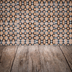 Image showing Wood table top and blur vintage ceramic tile pattern wall