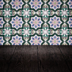 Image showing Wood table top and blur vintage ceramic tile pattern wall