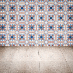 Image showing Wood table top and blur vintage ceramic tile pattern wall