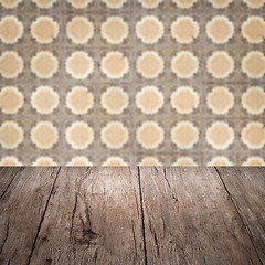 Image showing Wood table top and blur vintage ceramic tile pattern wall