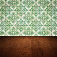 Image showing Wood table top and blur vintage ceramic tile pattern wall