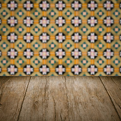 Image showing Wood table top and blur vintage ceramic tile pattern wall