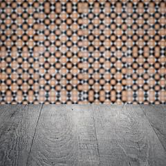 Image showing Wood table top and blur vintage ceramic tile pattern wall