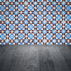 Image showing Wood table top and blur vintage ceramic tile pattern wall