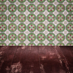 Image showing Wood table top and blur vintage ceramic tile pattern wall