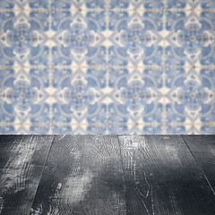 Image showing Wood table top and blur vintage ceramic tile pattern wall