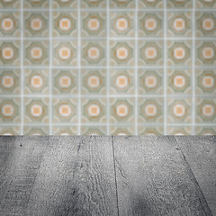 Image showing Wood table top and blur vintage ceramic tile pattern wall