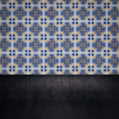 Image showing Wood table top and blur vintage ceramic tile pattern wall