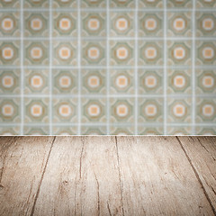 Image showing Wood table top and blur vintage ceramic tile pattern wall