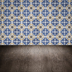 Image showing Wood table top and blur vintage ceramic tile pattern wall