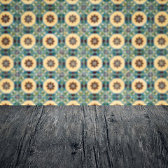 Image showing Wood table top and blur vintage ceramic tile pattern wall